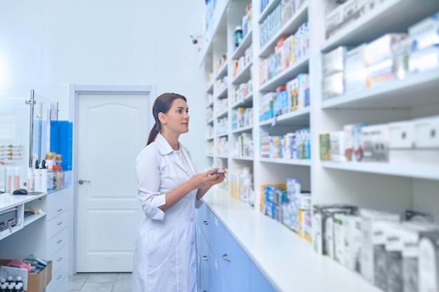 female pharmacist working in drugstore